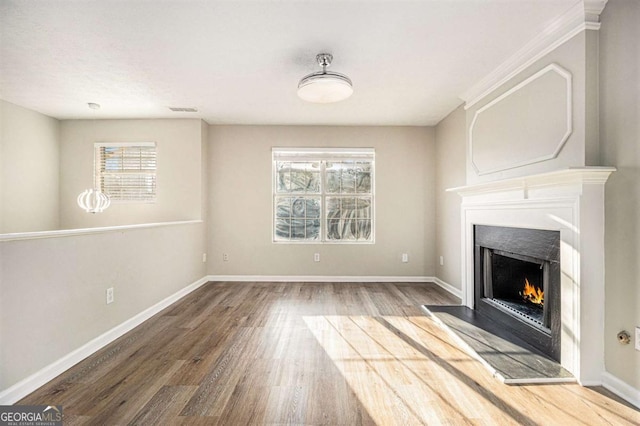 unfurnished living room with hardwood / wood-style flooring