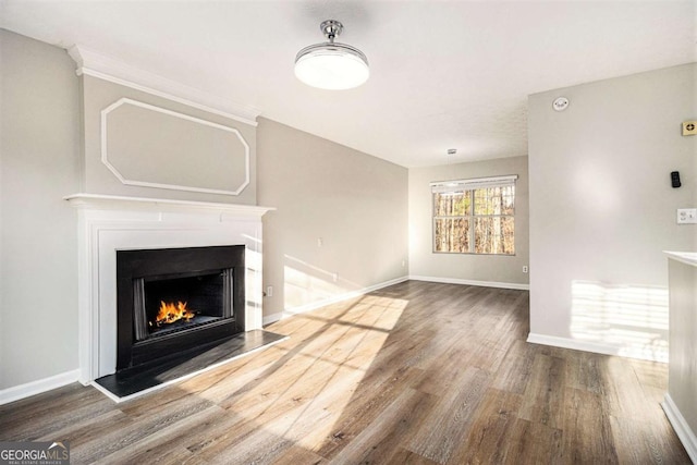 unfurnished living room featuring wood-type flooring