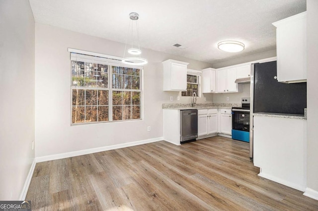 kitchen with white cabinetry, decorative light fixtures, light hardwood / wood-style floors, and appliances with stainless steel finishes