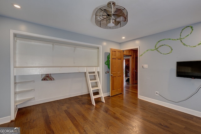 unfurnished living room featuring dark hardwood / wood-style floors