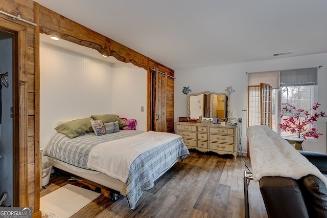 bedroom featuring dark hardwood / wood-style flooring