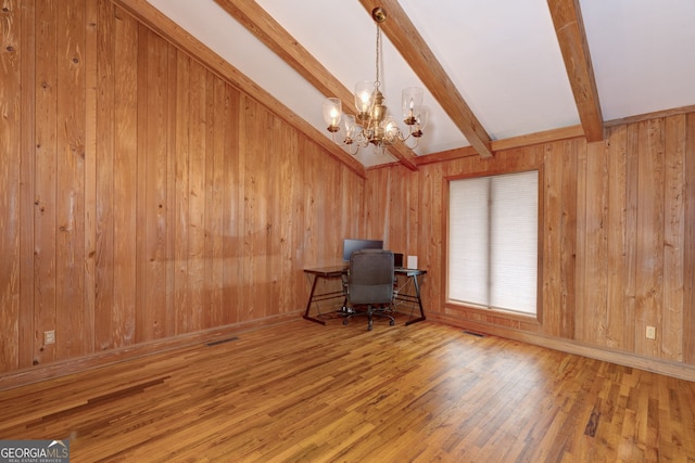 unfurnished office featuring hardwood / wood-style flooring, wooden walls, and beamed ceiling