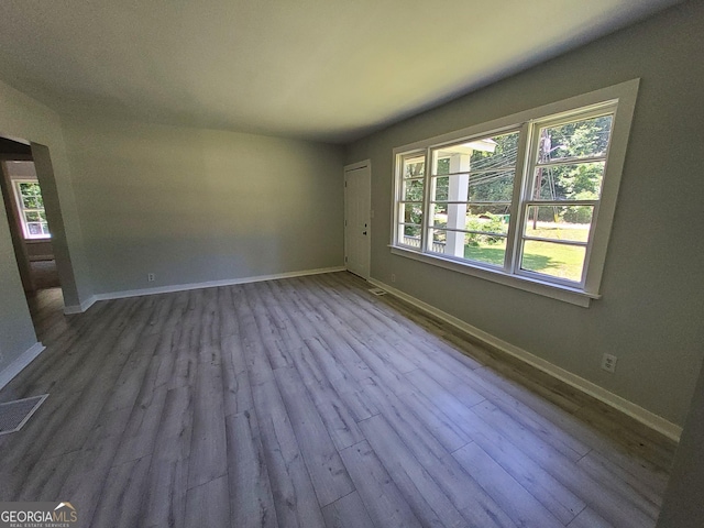 spare room featuring light hardwood / wood-style flooring