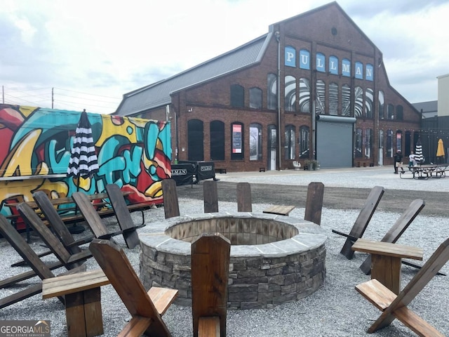 view of property's community featuring a fire pit