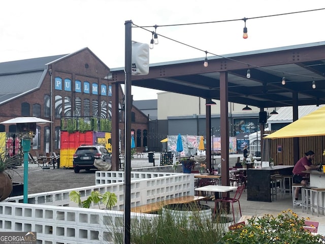 surrounding community featuring an outdoor bar