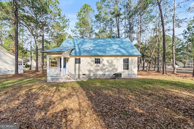 rear view of house featuring central air condition unit