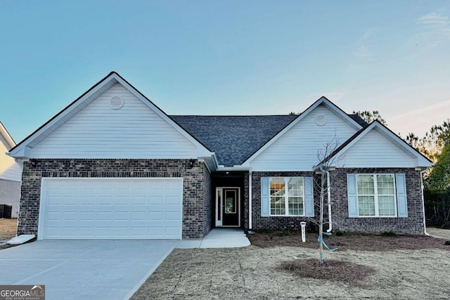 ranch-style house with a garage and cooling unit