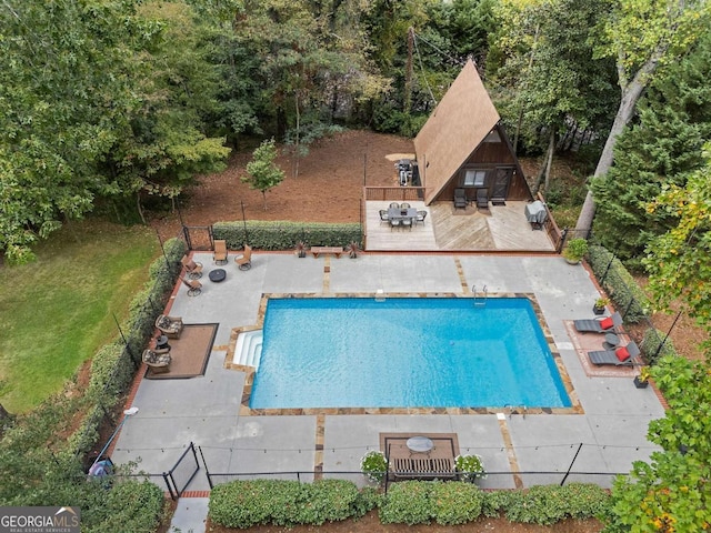 view of swimming pool featuring a patio area