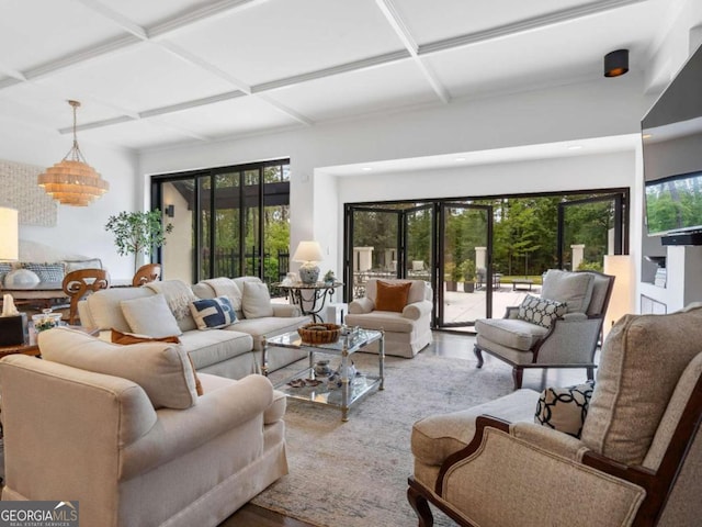 living room featuring wood finished floors, coffered ceiling, beamed ceiling, a chandelier, and recessed lighting