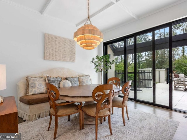 dining area featuring a wealth of natural light, beamed ceiling, coffered ceiling, and wood finished floors