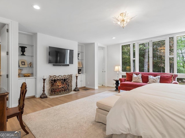 bedroom with recessed lighting, baseboards, and light wood-style floors
