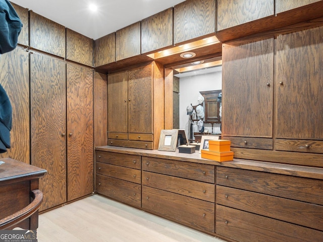 spacious closet with light wood-style floors