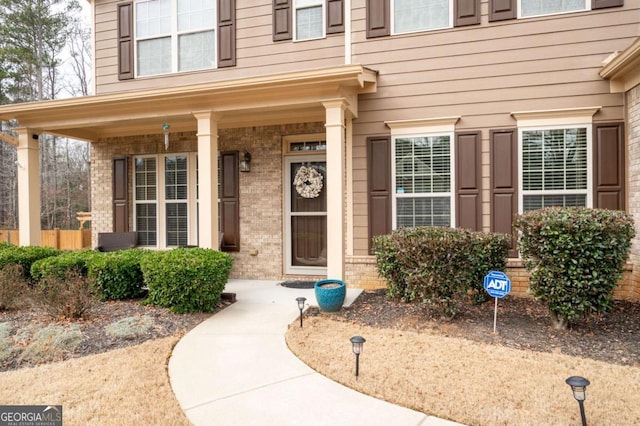 property entrance featuring a porch