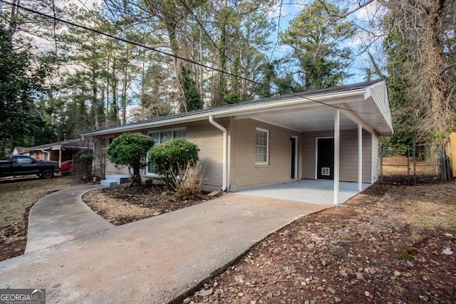 single story home featuring a carport