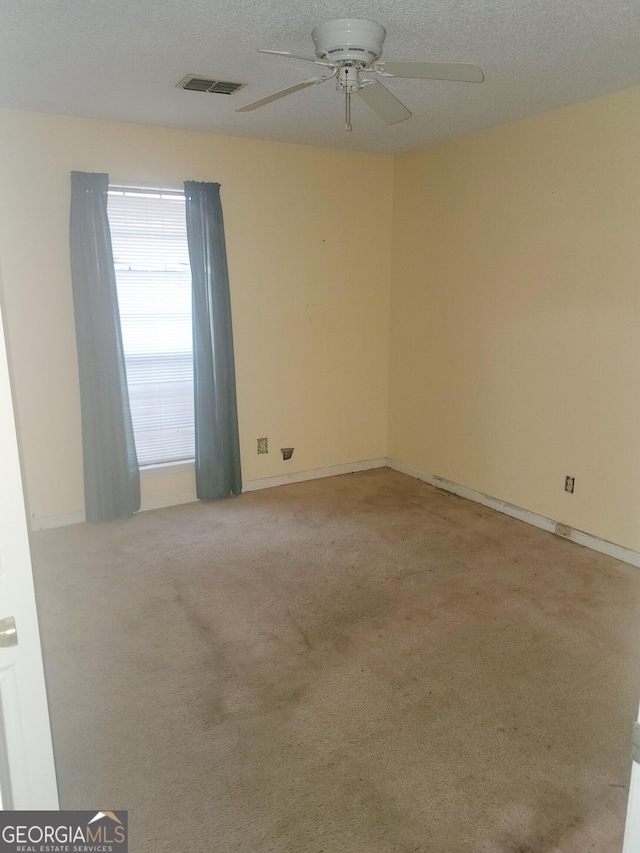 502 Navajo Ct, Albany, GA 31721 - empty room with light colored carpet, ceiling fan, visible vents, and baseboards