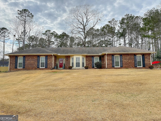 ranch-style home with a front lawn