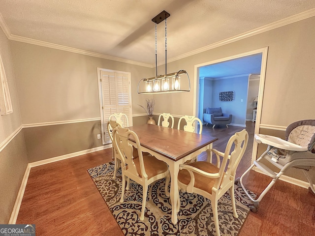 dining area featuring ornamental molding, dark hardwood / wood-style floors, and a textured ceiling