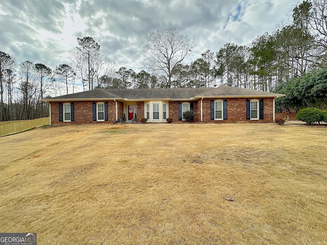 ranch-style home with a front lawn