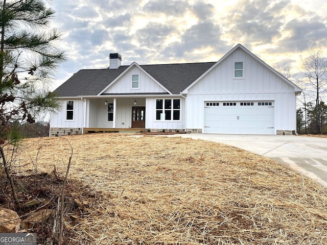 modern farmhouse featuring a garage