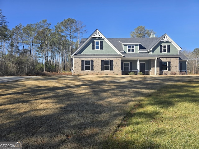 craftsman-style home featuring a front yard