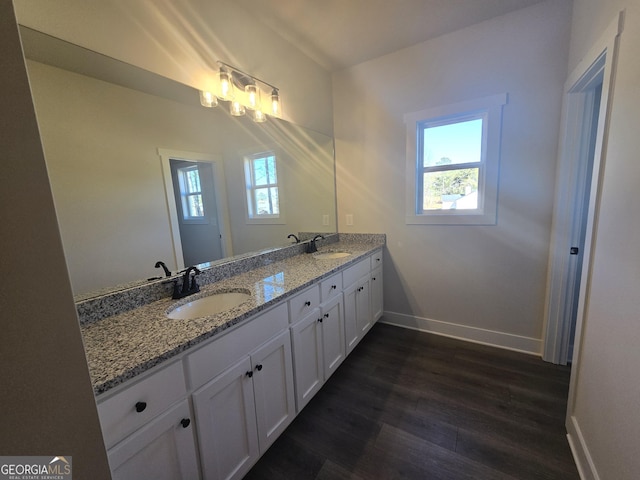 bathroom with vanity and hardwood / wood-style flooring