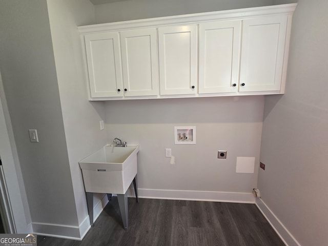 laundry room featuring cabinets, dark hardwood / wood-style flooring, hookup for a washing machine, and electric dryer hookup