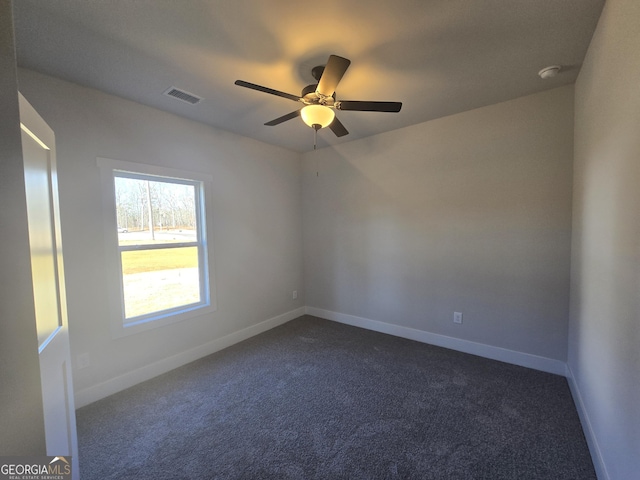 carpeted empty room featuring ceiling fan