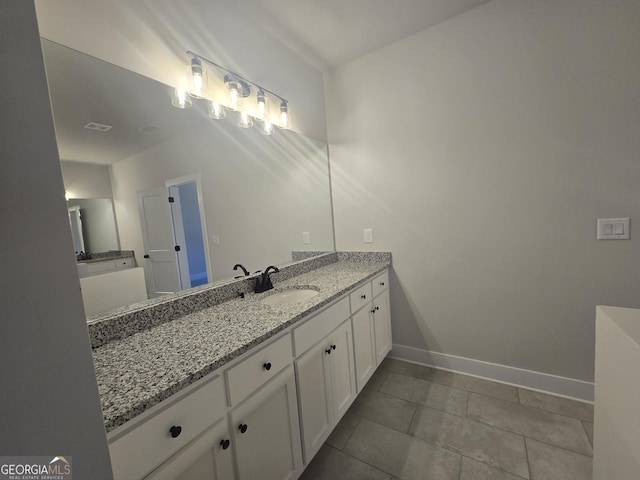 bathroom featuring tile patterned floors and vanity