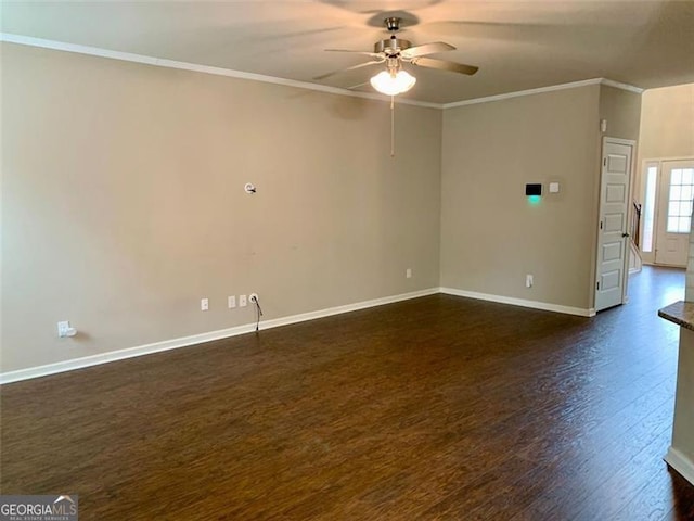 spare room featuring ornamental molding, dark hardwood / wood-style floors, and ceiling fan