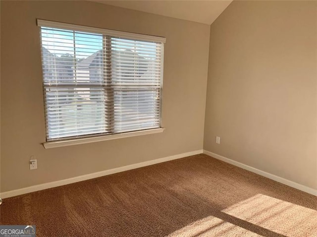 spare room featuring carpet floors