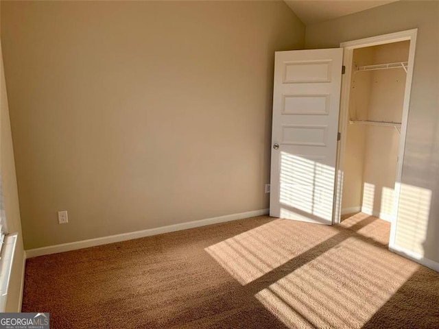 unfurnished bedroom featuring a closet and carpet