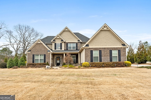 craftsman house featuring a front yard