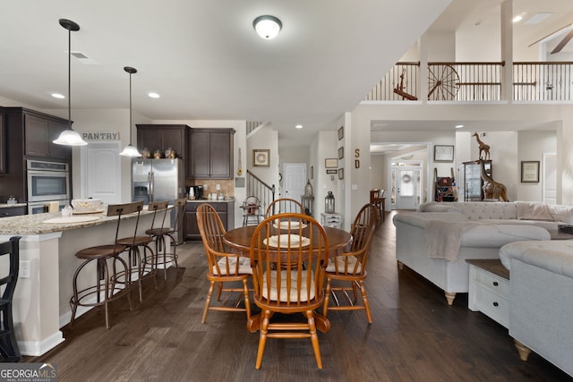 dining space featuring dark hardwood / wood-style floors