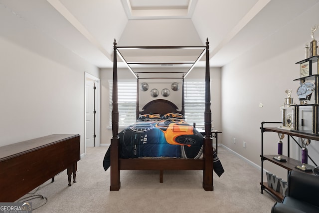 carpeted bedroom with lofted ceiling