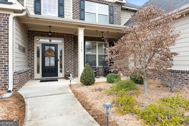 property entrance with covered porch