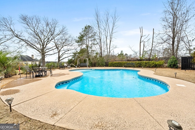 view of swimming pool featuring a patio area