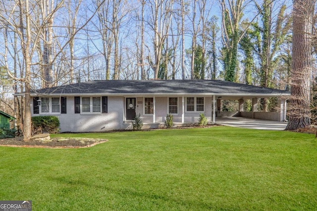 ranch-style home with a carport and a front lawn