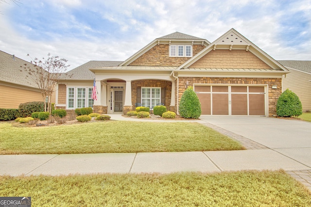 craftsman-style house with a garage and a front yard