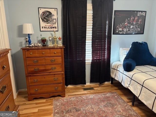 bedroom featuring light wood-type flooring