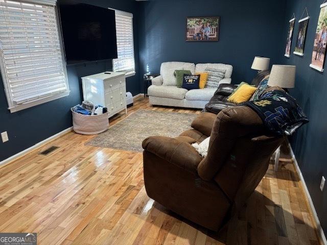 living room with light hardwood / wood-style flooring