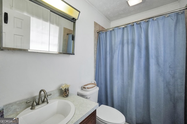 bathroom with vanity, a shower with curtain, toilet, and a textured ceiling