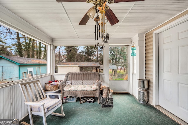 sunroom / solarium with ceiling fan