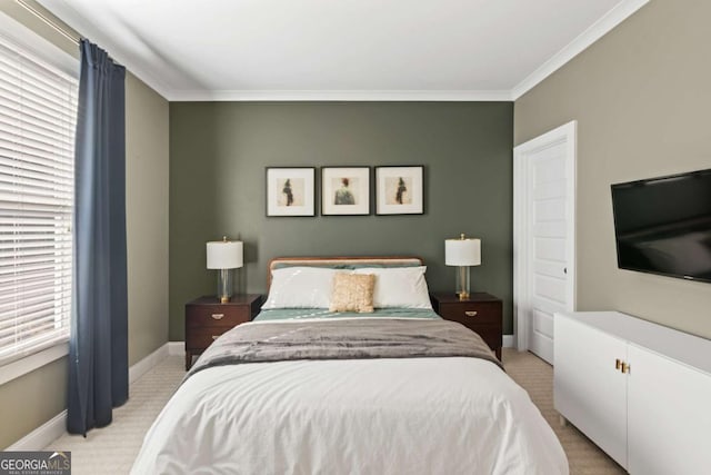 carpeted bedroom featuring crown molding