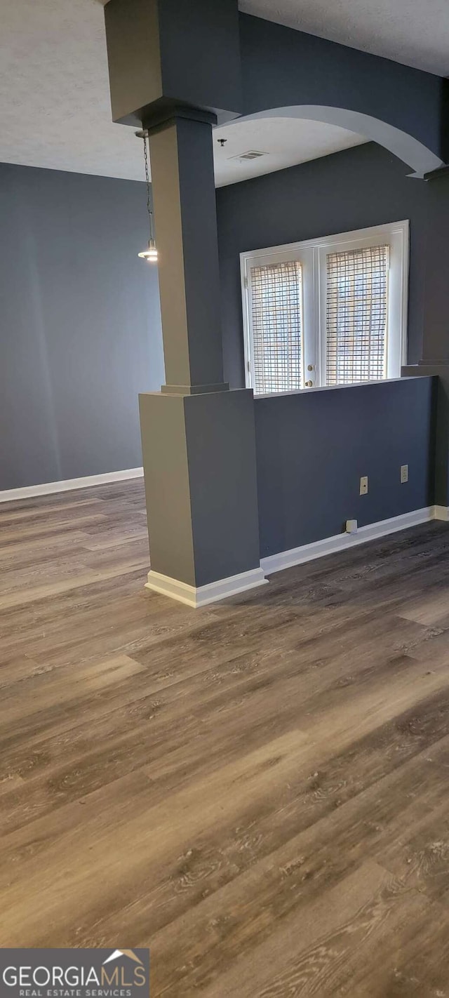 unfurnished room featuring wood-type flooring