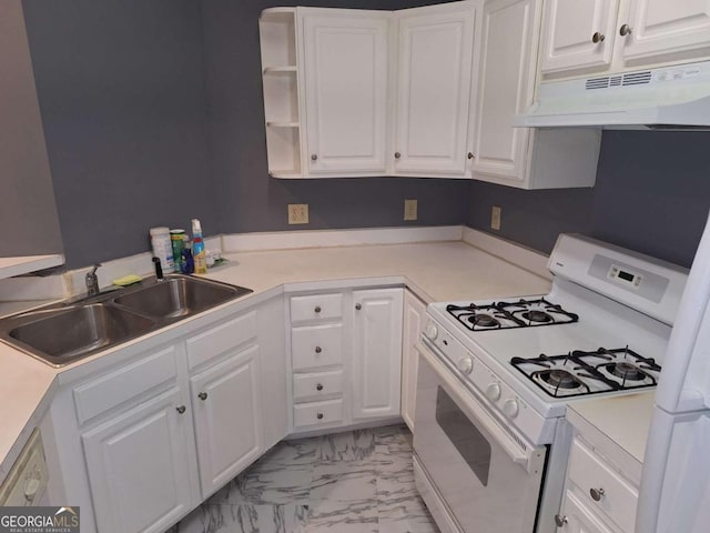 kitchen featuring white range with gas stovetop and white cabinets