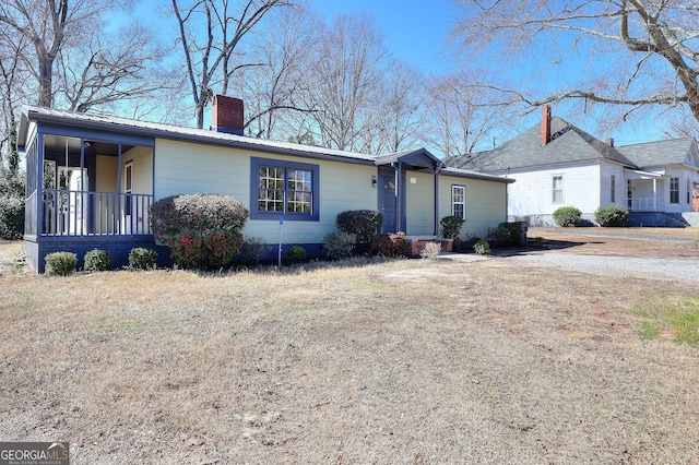 ranch-style house featuring a porch