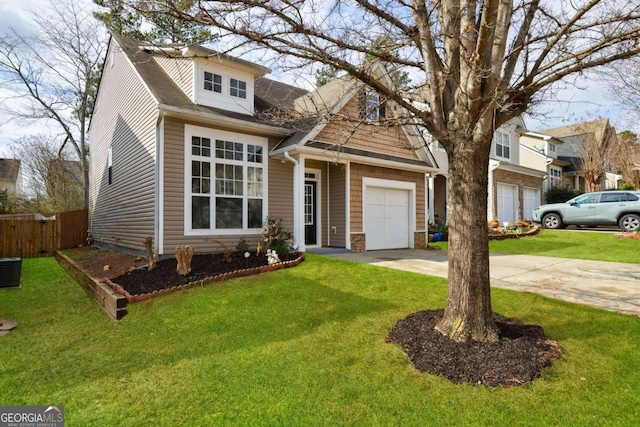 view of front of home featuring a garage and a front yard