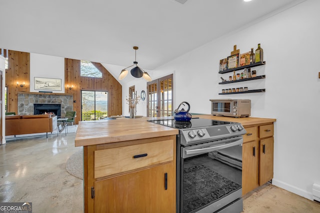 kitchen featuring a stone fireplace, wood walls, lofted ceiling, butcher block counters, and electric stove