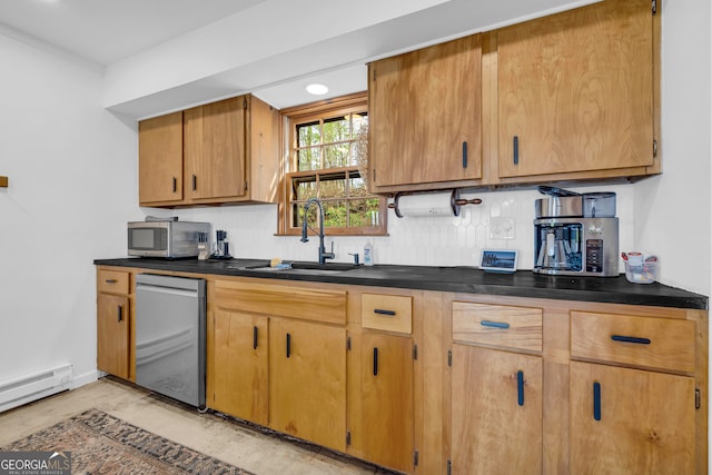 kitchen featuring sink, decorative backsplash, a baseboard radiator, and stainless steel appliances