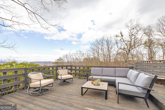 wooden deck featuring an outdoor hangout area